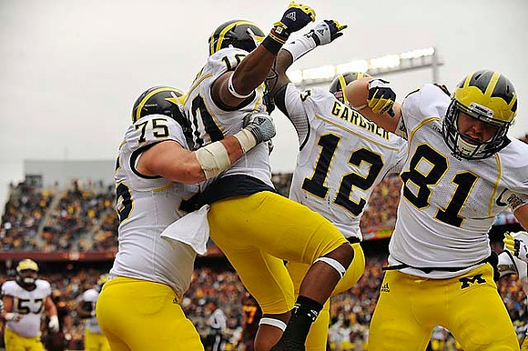 Michael Schofield (75), Jeremy Gallon (10), Devin Gardner (12), and Mike Kwiatkowski (81)