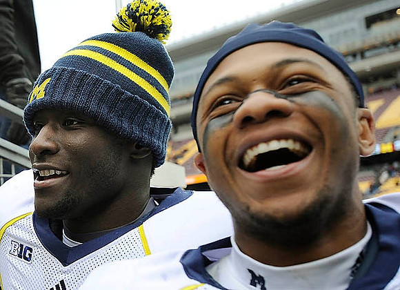 Devin Gardner (12) and Roy Roundtree (21)