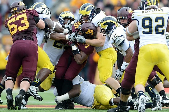 Quinton Washington (76), Kenny Demens (25), Brennen Beyer (97), James Ross (15), and Keith Heitzman (92)