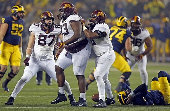 Mason Cole (52), Brandon Peters (18), and Ben Bredeson (74)