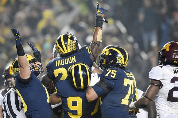 Henry Poggi (19), Karan Higdon (22), Donovan Peoples-Jones (9), and Jon Runyan Jr. (75)