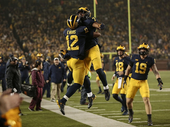 Chris Evans (12), Khaleke Hudson (7), Brandon Peters (18), and Henry Poggi (19)