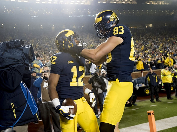 Chris Evans (12) and Zach Gentry (83)