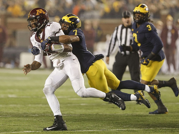 Khaleke Hudson (7) and Rashan Gary (3)