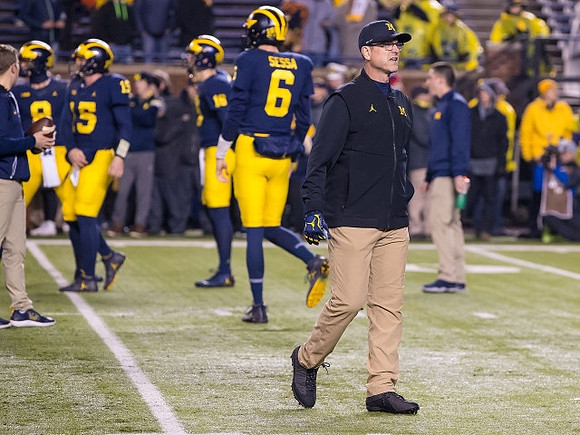 Alex Malzone (15), Brandon Peters (18), Michael Sessa (6), and Jim Harbaugh