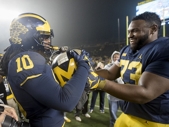 Devin Bush (10), Maurice Hurst (73), and The Little Brown Jug