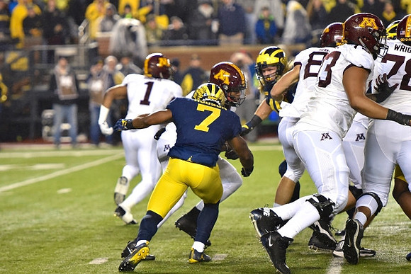 Khaleke Hudson (7) and Chase Winovich (15)