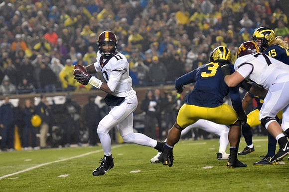 Rashan Gary (3) and Chase Winovich (15)