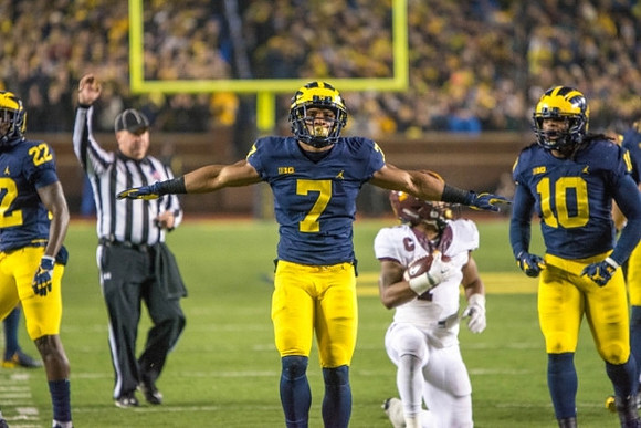 David Long (22), Khaleke Hudson (7), and Devin Bush (10)