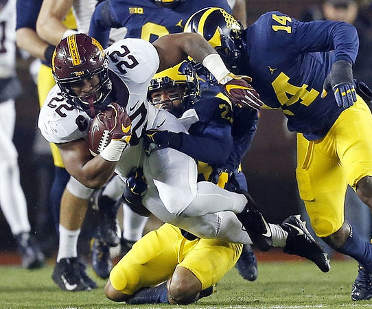 Tyree Kinnel (23) and Josh Metellus (14)