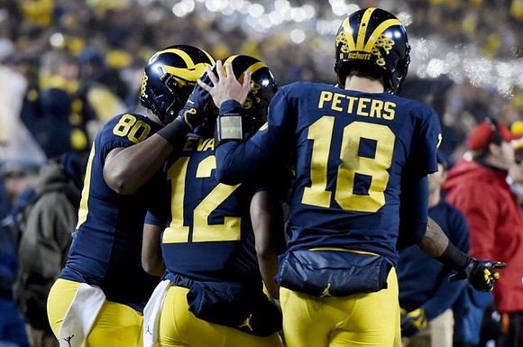 Khalid Hill (80), Chris Evans (12), and Brandon Peters (18)
