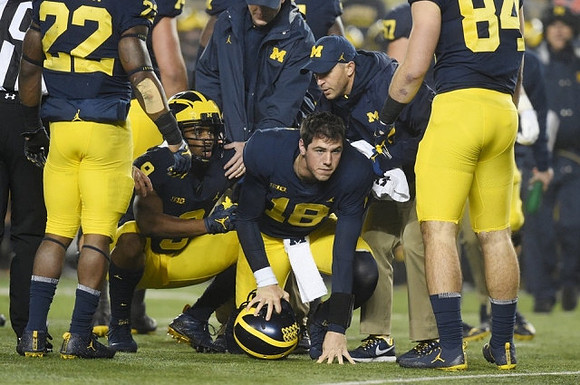 Karan Higdon (22), Donovan Peoples-Jones (9), Brandon Peters (18), and Sean McKeon (84)