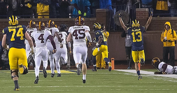 Ben Bredeson (74), Chris Evans (12), and Eddie McDoom (13)