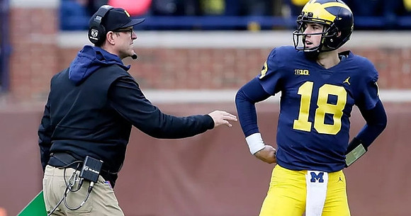 Jim Harbaugh and Brandon Peters (18)