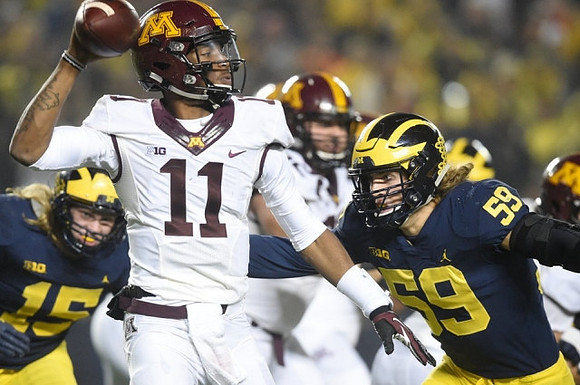 Chase Winovich (15) and Noah Furbush (59)