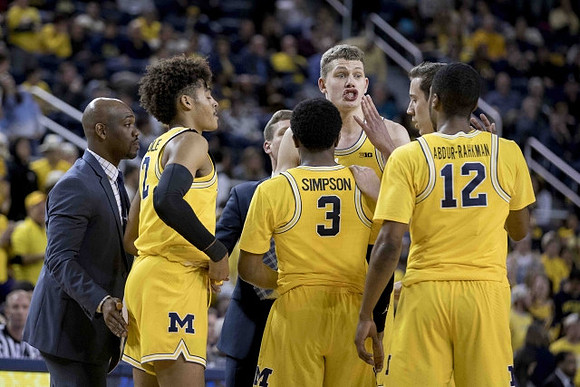 Deandre Haynes, Jordan Poole (2), Luke Yaklich, Zavier Simpson (3), Moritz Wagner (13), Duncan Robinson (22), and Muhammad-Ali Abdur-Rahkman (12)
