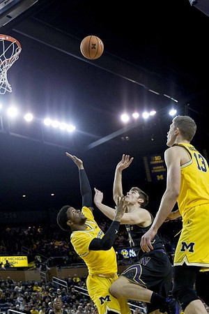 Zavier Simpson (3) and Moritz Wagner (13)