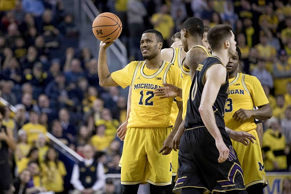 Muhammad-Ali Abdur-Rahkman (12) and Zavier Simpson (3)