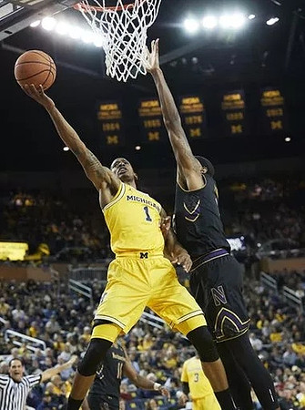 Charles Matthews (1) and Zavier Simpson (3)