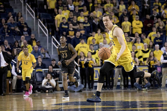 Muhammad-Ali Abdur-Rahkman (12) and Duncan Robinson (22)
