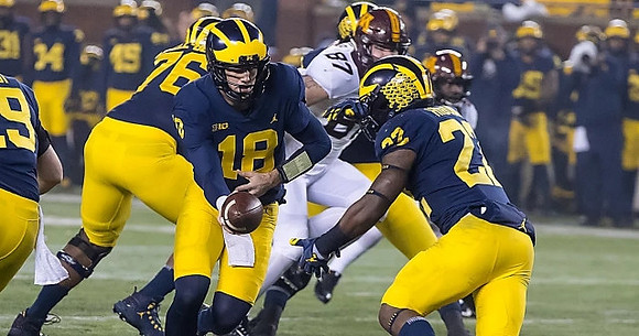 Henry Poggi (19), Juwann Bushell-Beatty (76), Brandon Peters (18), and Karan Higdon (22)