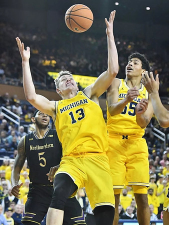 Moritz Wagner (13) and Eli Brooks (55)