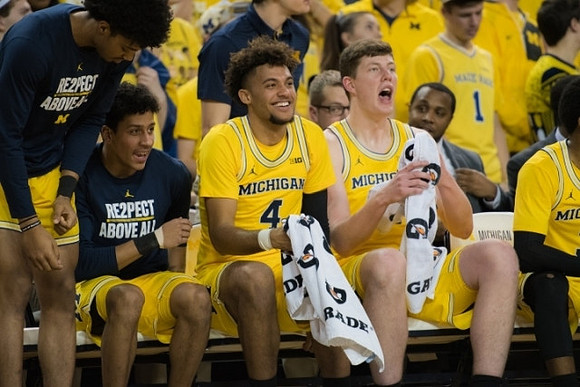 Ibi Watson (23), Eli Brooks (55), Isaiah Livers (4), and Jon Teske (15)