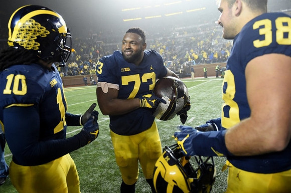 Devin Bush (10), Maurice Hurst (73), and Jared Wangler (38)