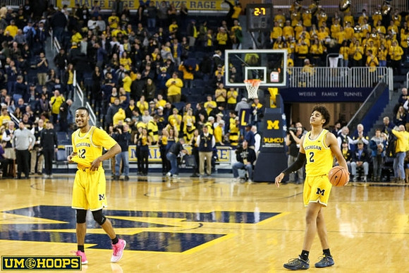 Muhammad-Ali Abdur-Rahkman (12) and Jordan Poole (2)