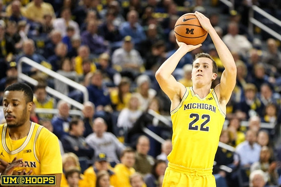 Muhammad-Ali Abdur-Rahkman (12) and Duncan Robinson (22)