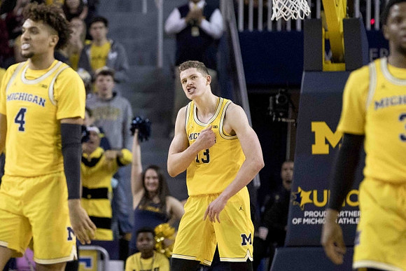 Isaiah Livers (4), Moritz Wagner (13), and Zavier Simpson (3)