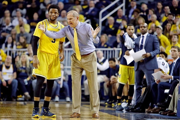 Zavier Simpson (3) and John Beilein