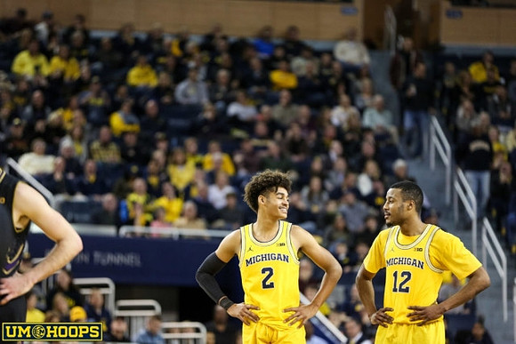 Jordan Poole (2) and Muhammad-Ali Abdur-Rahkman (12)