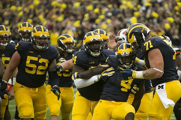 Mason Cole (52), A.J. Williams (84), De'Veon Smith (4), and Ben Braden (71)