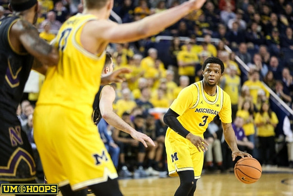 Moritz Wagner (13) and Zavier Simpson (3)