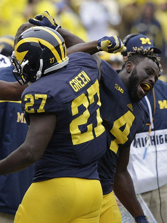 Derrick Green (27) and De'Veon Smith (4)