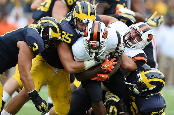 Desmond Morgan (3), Joe Bolden (35), and Mario Ojemudia (53)