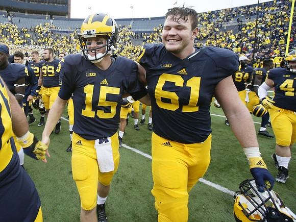 Jake Rudock (15) and Graham Glasgow (61)