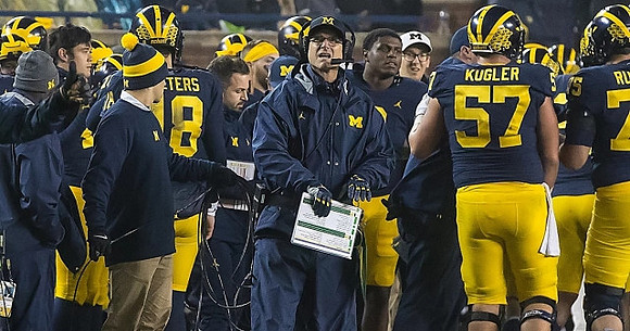 Brandon Peters (18), Jim Harbaugh, Patrick Kugler (57), and Jon Runyan Jr. (75)