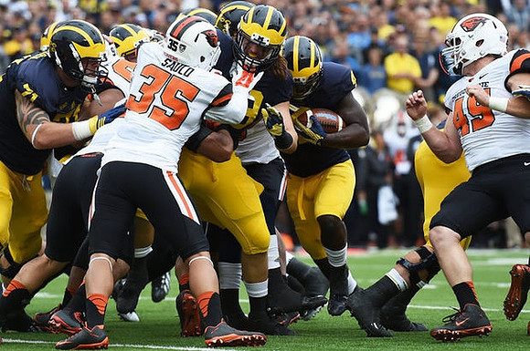 Ben Braden (71) and De'Veon Smith (4)