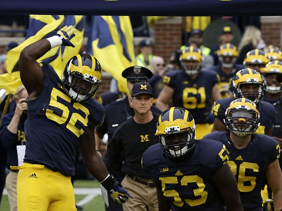Royce Jenkins-Stone (52), Jim Harbaugh, Mario Ojemudia (53), Joe Kerridge (36), and Graham Glasgow (61)