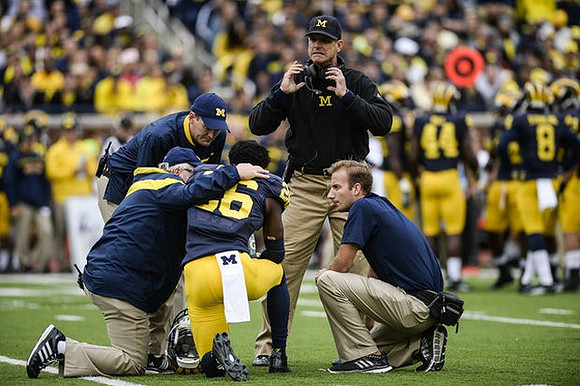 Jourdan Lewis (26) and Jim Harbaugh