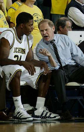 DeShawn Sims (34) and John Beilein