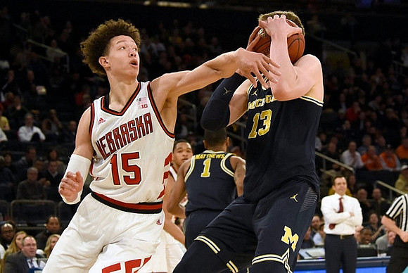 Moritz Wagner (13), Charles Matthews (1), and Nebraska Head Coach Tim Miles