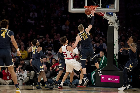 Isaiah Livers (4), Zavier Simpson (3), Moritz Wagner (13), and Charles Matthews (1)