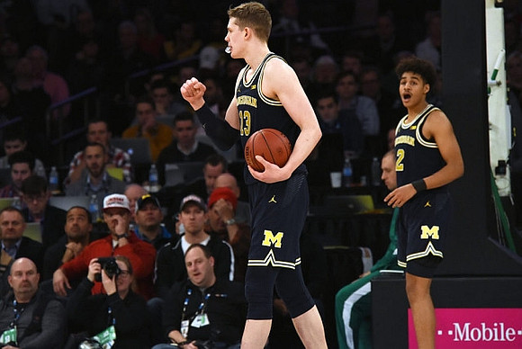 Moritz Wagner (13) and Jordan Poole (2)