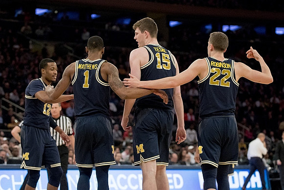 Muhammad-Ali Abdur-Rahkman (12), Charles Matthews (1), Jon Teske (15), and Duncan Robinson (22)