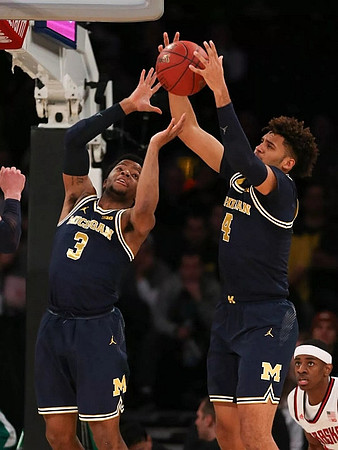 Zavier Simpson (3) and Isaiah Livers (4)