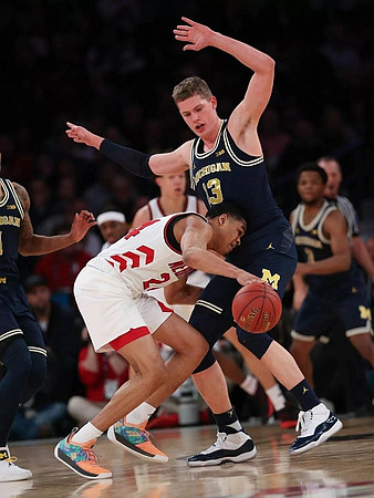 Moritz Wagner (13) and Zavier Simpson (3)