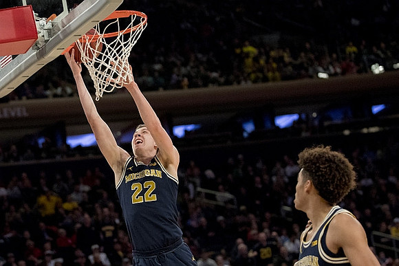 Duncan Robinson (22) and Jordan Poole (2)